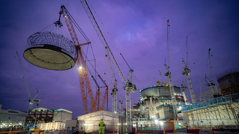 Engineering teams use the world&#39;s largest crane - Big Carl - to lift a 245-tonne steel dome onto Hinkley Point C&#39;s first reactor building, at the nuclear power station construction site in Bridgwater, Somerset. The 14-metre tall dome is manoeuvred into position on top of the 44-metre high reactor building in the early hours of Friday morning. This milestone in the construction closes the reactor building, allowing the first nuclear reactor to be installed inside. Picture date: Friday December 15