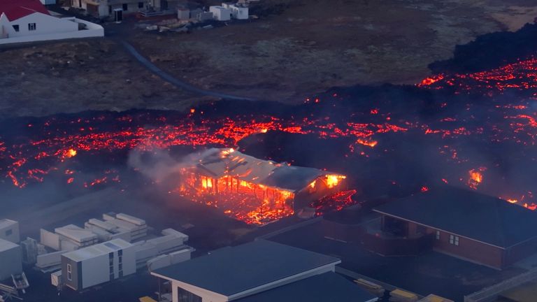Lava flows from a volcano as houses burn in Grindavik, Iceland
Pic:@bsteinbek/Reuters