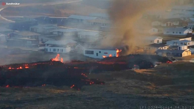 Lava reaches buildings near the town of Grindavik. Pic: AP