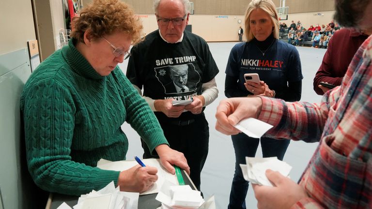 Votes are counted during a caucus at Fellows Elementary School, in Ames, Iowa