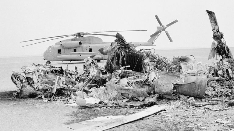Remains of a burned-out U.S. helicopter lies in front of abandoned chopper in the eastern desert region of Iran, April 27, 1980, one day after an abortive American commando raid to free the U.S. Embassy hostages. (AP Photo)


