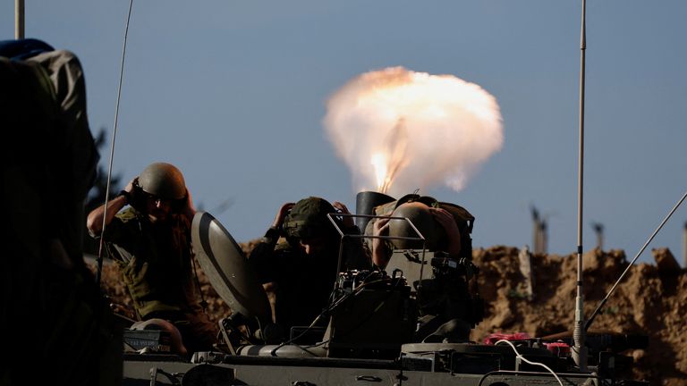 Israeli soldiers fire a mortar on the border of Gaza