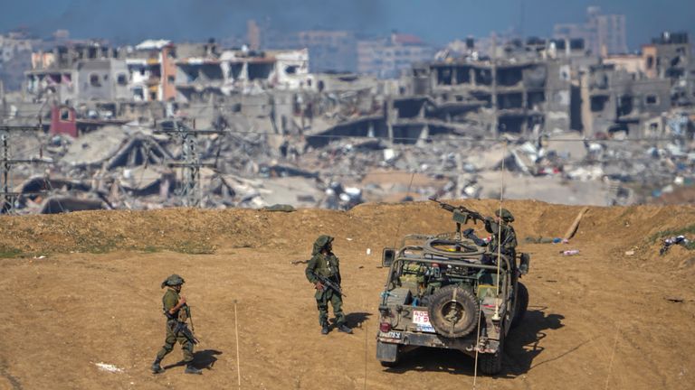 Israeli army troops are seen near the Gaza Strip border, in southern Israel, Sunday, Dec. 24, 2023. The army is battling Palestinian militants across Gaza in the war ignited by Hamas&#39; Oct. 7 attack into Israel. (AP Photo/Ariel Schalit)