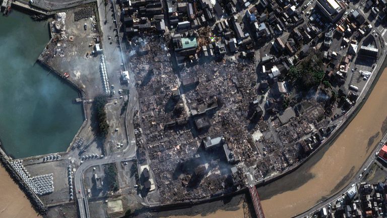 This satellite image provided by Maxar Technologies shows a damaged neighborhood in Wajima, Japan, Tuesday, Jan. 2, 2024. A series of powerful earthquakes that hit western Japan have left at least 55 people dead and damaged thousands of buildings, vehicles and boats. Officials warned Tuesday that more quakes could lie ahead.  (Maxar Technologies via AP)