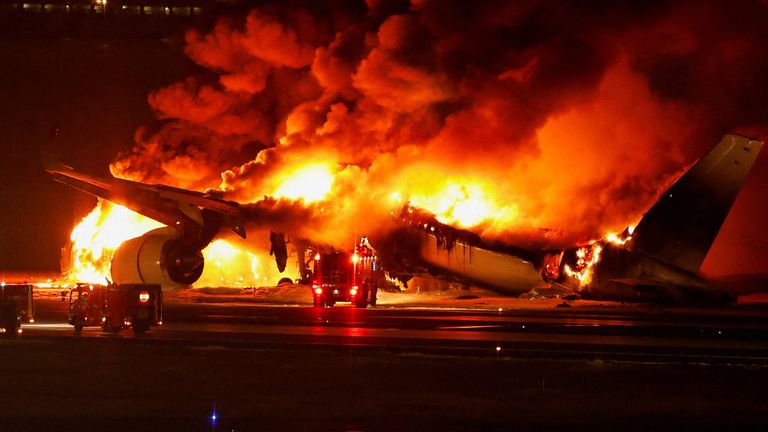 The airplane explodes in fire at the runway