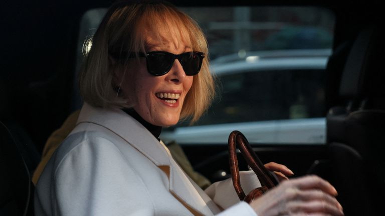 E. Jean Carroll smiles after the leaving the court building