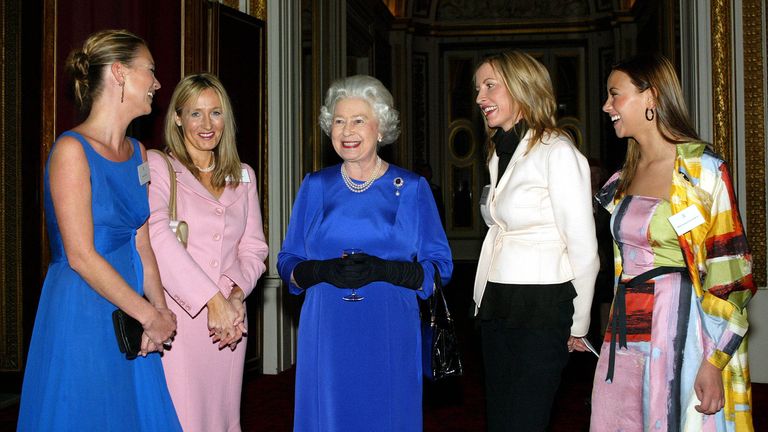 Britain's Queen Elizabeth (C) talks to British model Kate Moss (L), author J K Rowling (2L), landmine campaigner Heather Mills-McCartney (2R) and singer Charlotte Church (R) at a reception for women achievers at Buckingham Palace in London, March 11, 2004. REUTERS/POOL/Kent Gavin PP04030052 ASA/JV
