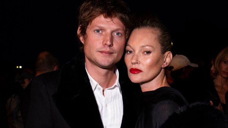 Kate Moss, right, and Nikolai von Bismarck arrive for the Saint Laurent Spring/Summer 2023 fashion collection presented Tuesday, Sept. 27, 2022 in Paris. (Photo by Vianney Le Caer/Invision/AP)