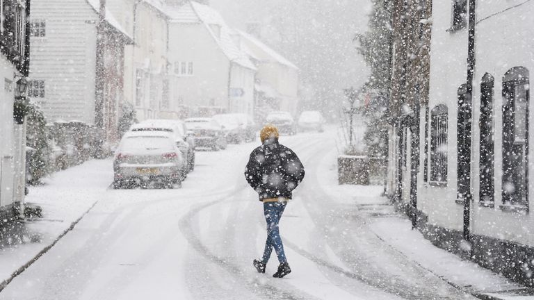 A person walking through a snow flurry in Lenham, Kent. Sleet and snow showers have been forecast for parts of the country on Monday as some regions are still trying to grapple with flooding following intense rainfall. Picture date: Monday January 8, 2024.