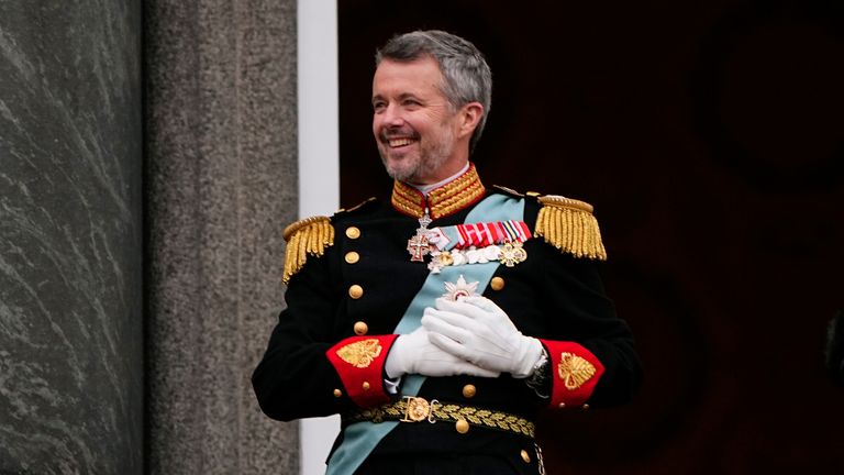 Denmark&#39;s King Frederik X smiles on the balcony, after the proclamation, at Christiansborg Palace, in Copenhagen, Sunday, Jan. 14, 2024. Denmark...s prime minister proclaimed Frederik X as king after his mother Queen Margrethe II formally signed her abdication. Massive crowds turned out to rejoice in the throne passing from a beloved monarch to her popular son. (Bo Amstrup/Ritzau Scanpix via AP)