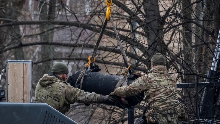 Bomb squad members load a part of a missile on a truck after a Russian missile attack, amid Russia&#39;s attack on Ukraine, in Kyiv, Ukraine January 23, 2024. REUTERS/Viacheslav Ratynskyi