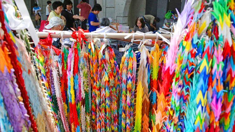 People make thousand paper cranes to offer a prayer for the victims at Uji Station in Uji City, Kyoto Prefecture on August 4, 2019. On the morning of 18th, a fire occurred with an explosion sound at a studio of an animation production company "Kyoto Animation Co., Ltd. (so-called Kyoani)" in Fushimi Ward, Kyoto City and 35 staffs died. 41-year-old man Shinji Aoba allegedly splashed gasoline in the building while screaming "Die!" reportedly said, "They stole my idea" when Aoba was taken by police. Kyoto Animation produced poplar animations such as "K-On!", "The Melancholy of Haruhi Suzumiya" and" Sound! Euphonium". Kyoto prefectural police released the names of 10 out of 35 victims who agreed to the bereaved. Yasuhiro Takemoto, a director of "Lucky Star", was included.   ( The Yomiuri Shimbun via AP Images )