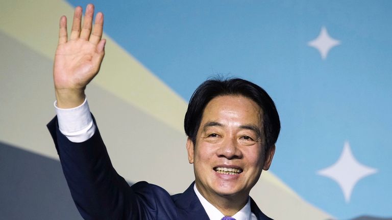 Lai Ching-te waves while declaring victory in the election