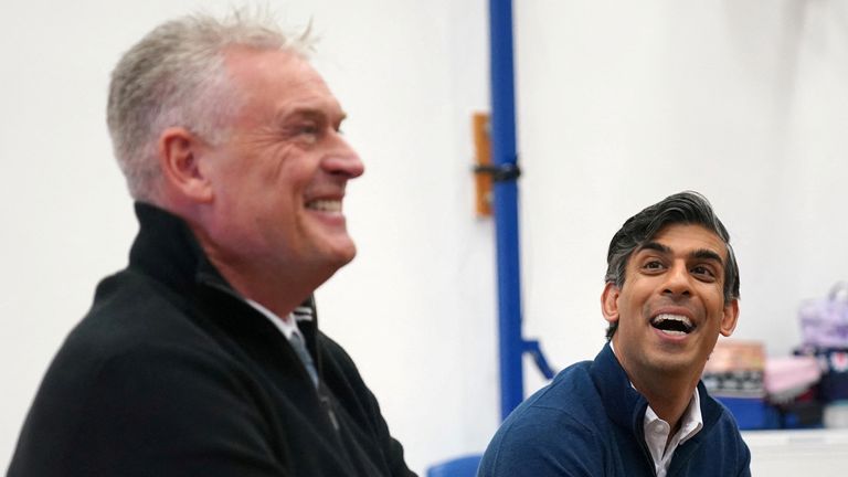 British Prime Minister Rishi Sunak and Lee Anderson, MP for Ashfield react during a visit to Woodland View Primary School in Sutton-in-Ashfield, Nottinghamshire, Britain January 4, 2024. Jacob King/Pool via REUTERS