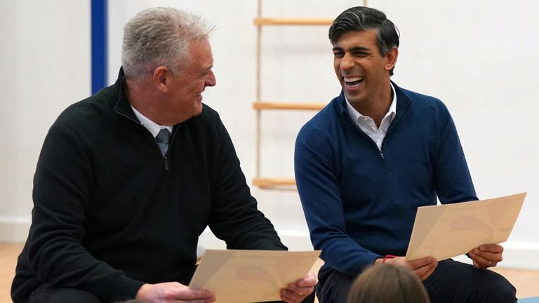 British Prime Minister Rishi Sunak and Lee Anderson, MP for Ashfield react during a visit to Woodland View Primary School in Sutton-in-Ashfield, Nottinghamshire, Britain January 4, 2024. Jacob King/Pool via REUTERS