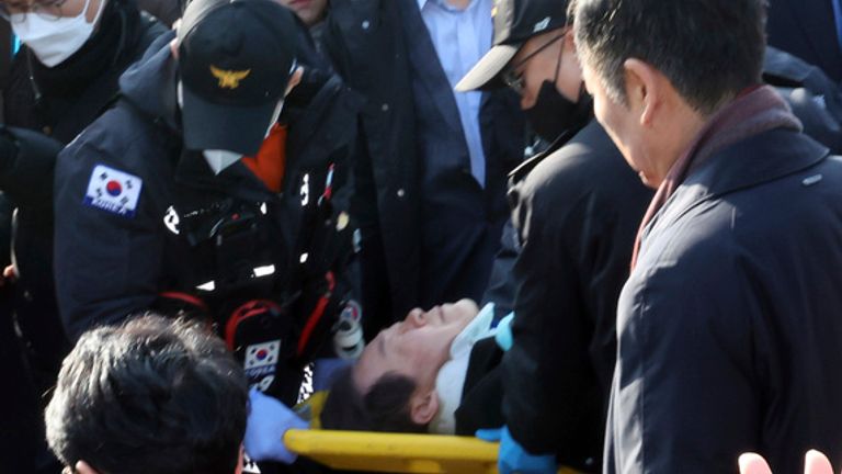 Lee was taken away on a stretcher. Pic: AP