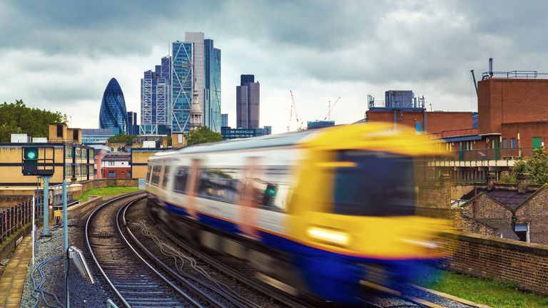 London Overground train with the gherkin in the background