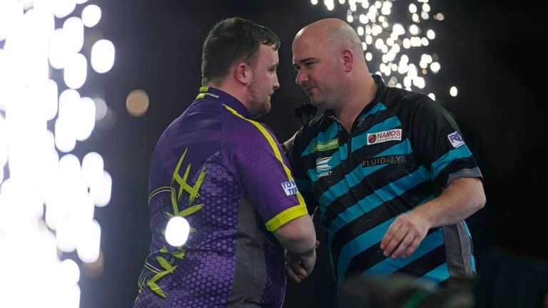Luke Littler shakes hands with Rob Cross after their semi final clash. Pic: AP