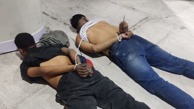 People accused of invading and taking over television station TC with weapons and forcing staff to lie and sit down, lie handcuffed on the floor in a police handout, in Guayaquil, Ecuador, January 9, 2024. Ecuadorean Police/Handout via REUTERS THIS IMAGE HAS BEEN SUPPLIED BY A THIRD PARTY. NO RESALES. NO ARCHIVES