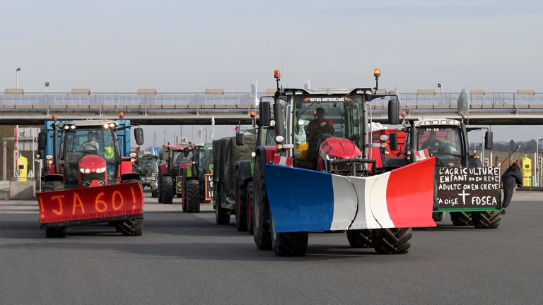 Farmers drive their tractors a highway leading to Paris.
Pic: AP