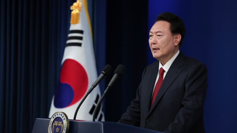 In this photo provided by South Korea Presidential Office, South Korean President Yoon Suk Yeol speaks during his New Year&#39;s speech at the presidential office in Seoul, South Korea, Monday, Jan. 1, 2024. (South Korea Presidential Office via AP)