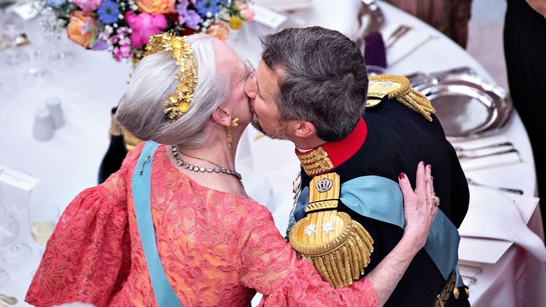 Crown Prince Frederik kisses his mother, Queen Margrethe, during his 50th birthday in May 2018