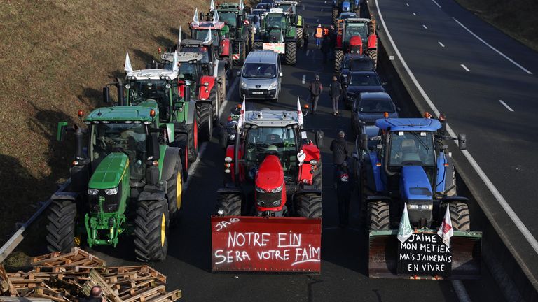 Tractors and other vehicles queue on the A16 highway as French farmers try to reach Paris during a protest  in Beauvais
Pic: Reuters