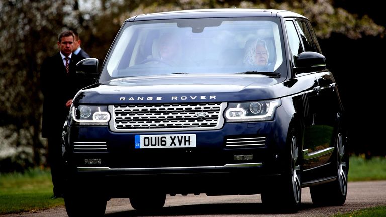 Prince Philip and Queen Elizabeth II in the Range Rover up for sale. Pic: James Shaw/Photoshot/Shutterstock
