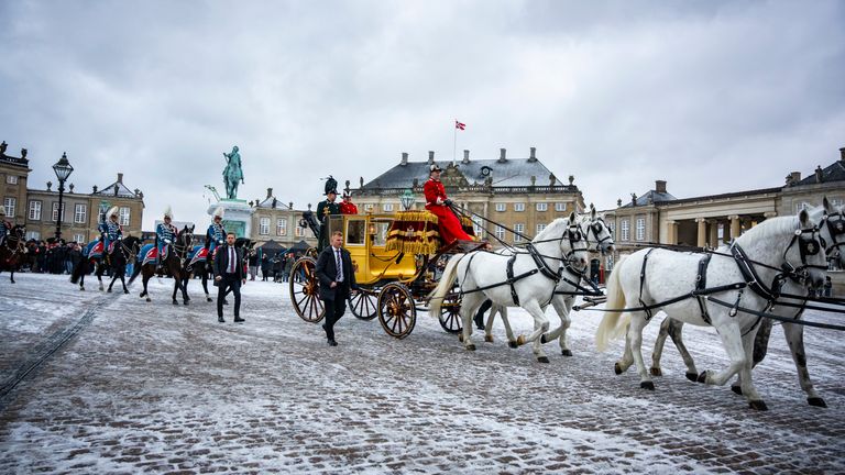 Queen Margrethe of Denmark is escorted by her hussar regiment as she rides in a horse-drawn coach from Christian IX's Palace, Amalienborg to Christiansborg Palace in Copenhagen, Denmark, Thursday, January 4, 2024. Europe Queen Margrethe, the country's longest-reigning monarch, traveled through the Danish capital Thursday in a gilded horse-drawn carriage. , as she concluded her last New Year celebrations before abdicating the throne later this month.  (Emil Nicolai Helms/Ritzau Scanpix via AP)