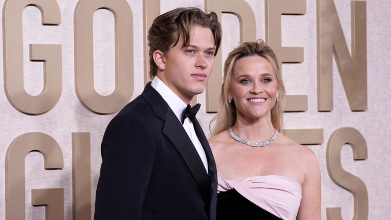 Deacon Reese Phillippe, left, and Reese Witherspoon arrive at the 81st Golden Globe Awards on Sunday, Jan. 7, 2024, at the Beverly Hilton in Beverly Hills, Calif. (Photo by Jordan Strauss/Invision/AP)