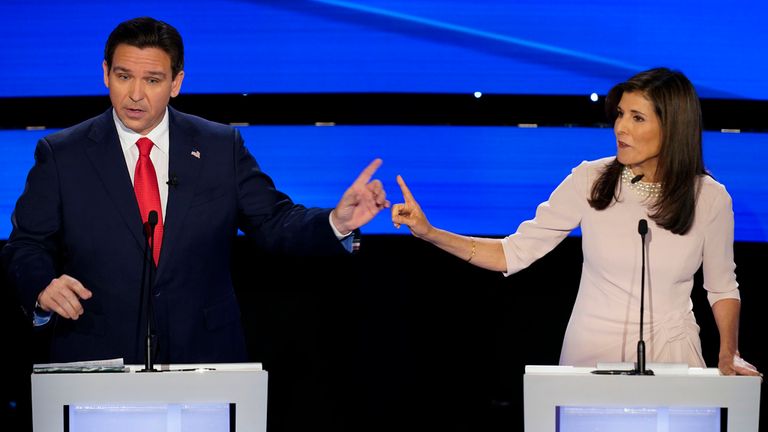 Former UN Ambassador Nikki Haley, right and Florida Gov. Ron DeSantis, left, pointing at each other during the CNN Republican presidential debate at Drake University in Des Moines, Iowa, Wednesday, Jan. 10, 2024. (AP Photo/Andrew Harnik)