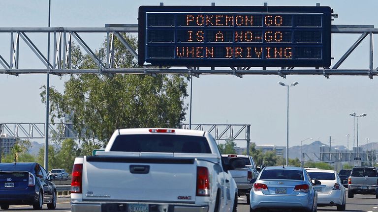 Pic: AP/David Kadlubowski/The Arizona Republic
An Arizona Dept. of Transportation (ADOT) freeway sign along westbound Interstate 10 discourages playing "Pokemon Go", Wednesday, July 13, 2016 in Phoenix. ADOT said the warnings will be posted on overhead highway signs around the state for the next week. (David Kadlubowski/The Arizona Republic via AP)