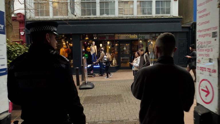 Rob Powell with Field officer Nick Strickland of Sussex Police on a shoplifting patrol
