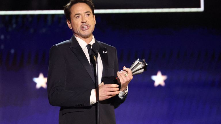 Robert Downey Jr receives the best supporting actor award for his role in Oppenheimer 