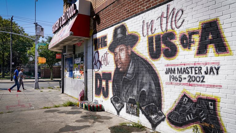 FILE - Pedestrians pass a mural, by artist Art1Airbrush, of rap pioneer Jam Master Jay of Run-DMC, Tuesday, Aug. 18, 2020, in the Queens borough of New York. Opening statements are set for Monday in the federal murder trial of Karl Jordan Jr. and Ronald Washington, who were arrested in 2020 for the murder of Jam Master Jay. (AP Photo/John Minchillo, File)