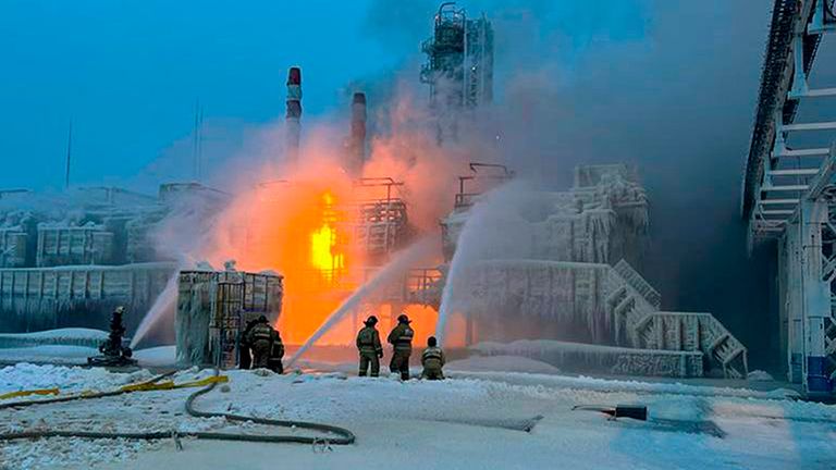 Firefighters work through the night to put out the blaze at the port on Sunday. Pic: AP/Telegram