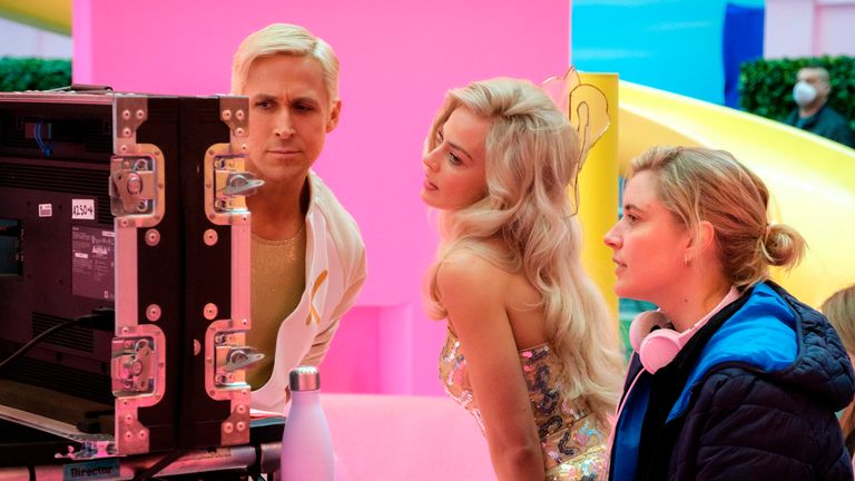 Gosling, Robbie, and Gerwig on the set of Barbie. Pic: Jaap Buitendijk/Warner Bros via AP