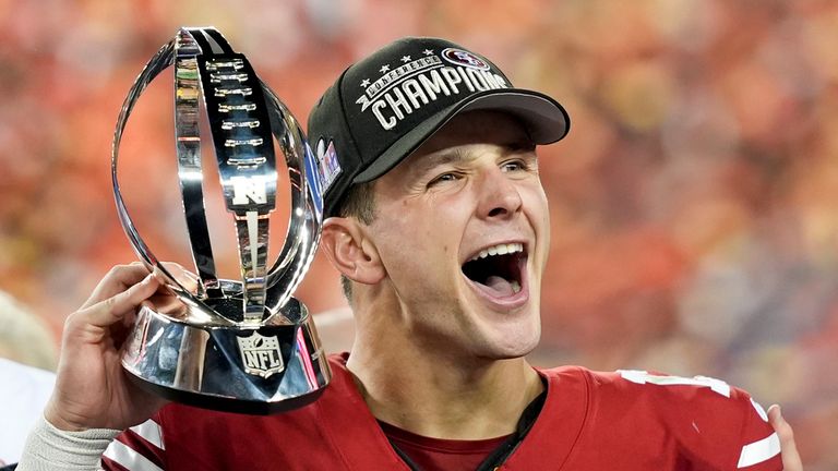 San Francisco 49ers quarterback Brock Purdy celebrates with the NFC Championship trophy. Pic: AP