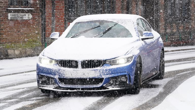 A car driving through a snow flurry in Lenham, Kent. Sleet and snow showers have been forecast for parts of the country on Monday as some regions are still trying to grapple with flooding following intense rainfall. Picture date: Monday January 8, 2024.