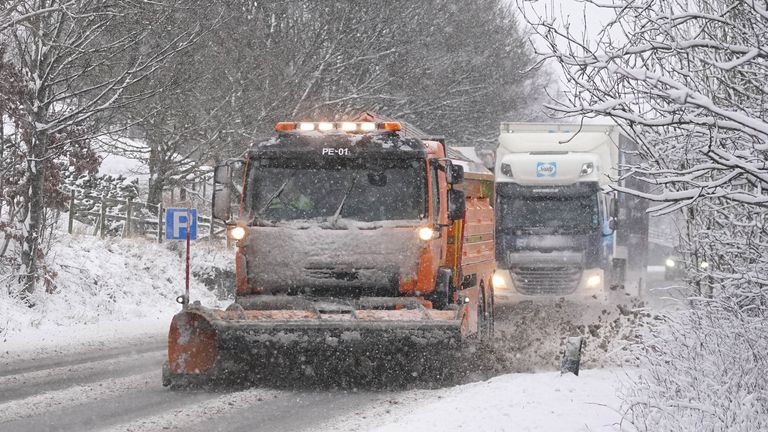 A snowplough on the A66 near Keswick in Cumbria. Much of Britain is facing another day of cold temperatures and travel disruption after overnight lows dropped below freezing for the bulk of the country. A "cold plunge of Arctic air" has moved south across the whole country over the past few days, making it 5C-6C lower than usual for this time of year, the Met Office said. Picture date: Tuesday January 16, 2024. PA Photo. Photo credit should read: Owen Humphreys/PA Wire 
