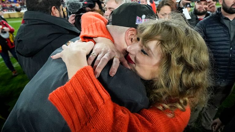 Taylor Swift embraces Travis Kelce, Sunday, Jan. 28, 2024, in Baltimore. Pic: AP Photo/Julio Cortez