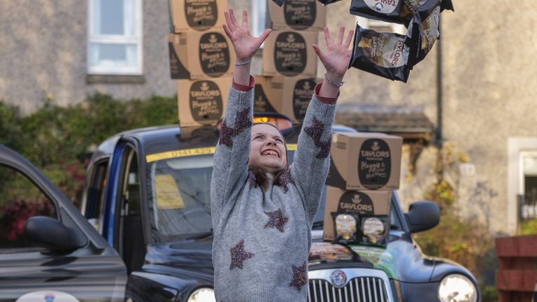 Grace celebrates winning a year's worth of crisps