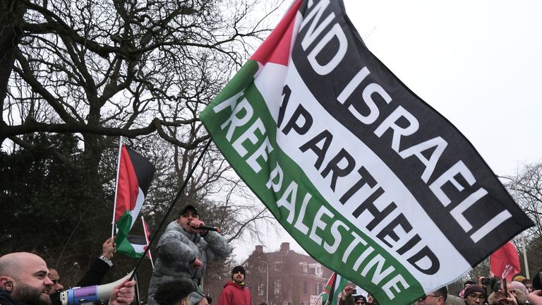 Protestors wave Palestinian flags during a demonstration march outside the International Court of Justice in The Hague, Netherlands, Thursday, Jan. 11, 2024. The United Nations&#39; top court opens hearings Thursday into South Africa&#39;s allegation that Israel&#39;s war with Hamas amounts to genocide against Palestinians, a claim that Israel strongly denies. Pic: AP Photo/Patrick Post