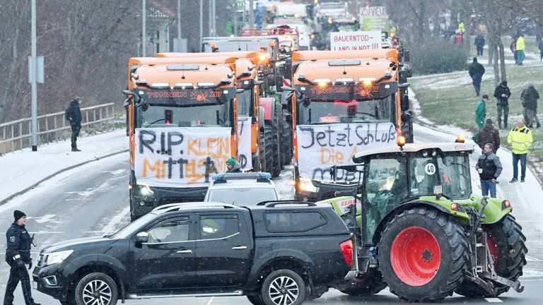 Tractors and trucks stand in a row during a blockade on Stauffenbergallee
Pic:AP