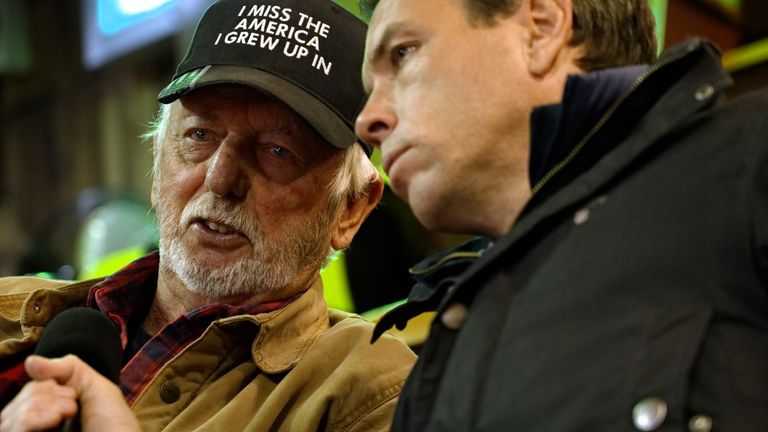 Retired rancher Tom Massey is wearing a cap that echoes the feelings of many Americans