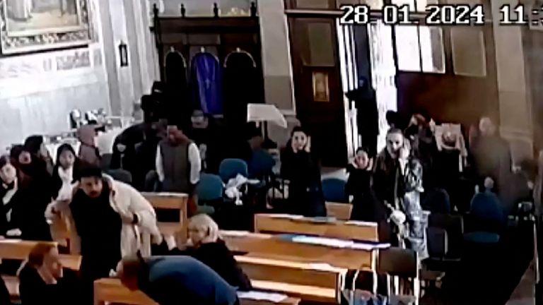 Pepole react during a deadly attack by two masked gunmen at the Italian Santa Maria Catholic Church in Istanbul, Turkey January 28, 2024, in this screenshot taken from CCTV video obtained by REUTERS THIS IMAGE HAS BEEN SUPPLIED BY A THIRD PARTY. NO RESALES. NO ARCHIVES.