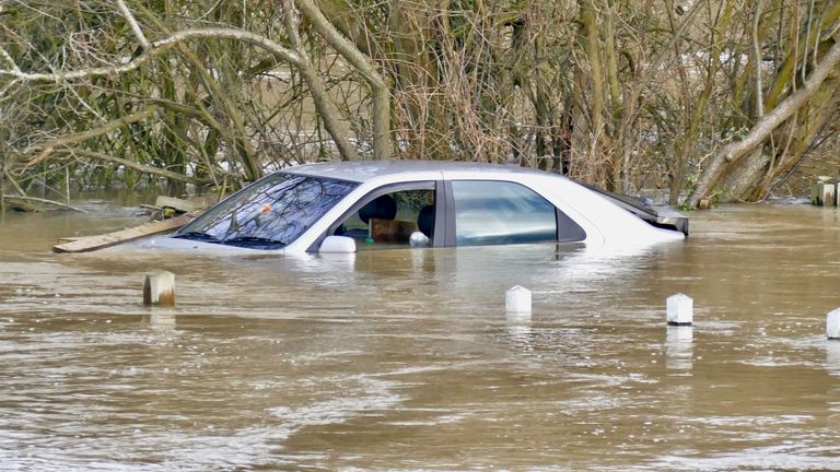 This car was almost completely submerged by flood water from the River Thames in Oxfordshire. Pic: Rex