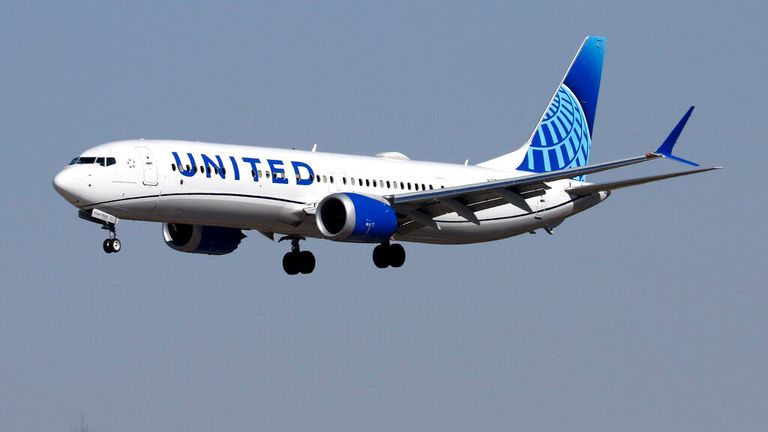 A Boeing 737 (737 MAX 9) jetliner, belonging to United Airlines (parent United Airlines Holdings, Inc.) and in new corporate livery, lands at Harry Reid (formerly McCarren) International Airport in Las Vegas, Nv., on Feb. 15, 2022. (Larry MacDougal via AP)