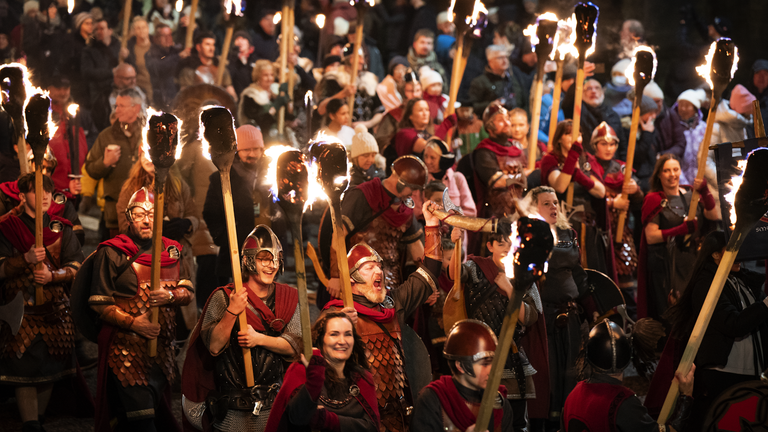Vikings from the Shetland South Mainland Up Helly Aa Jarl Squad leading the torchlight procession through Edinburgh city…
