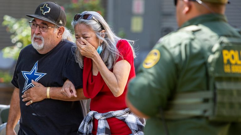 A woman crying on the day of the shooting. Pic: The San Antonio Express-News via AP